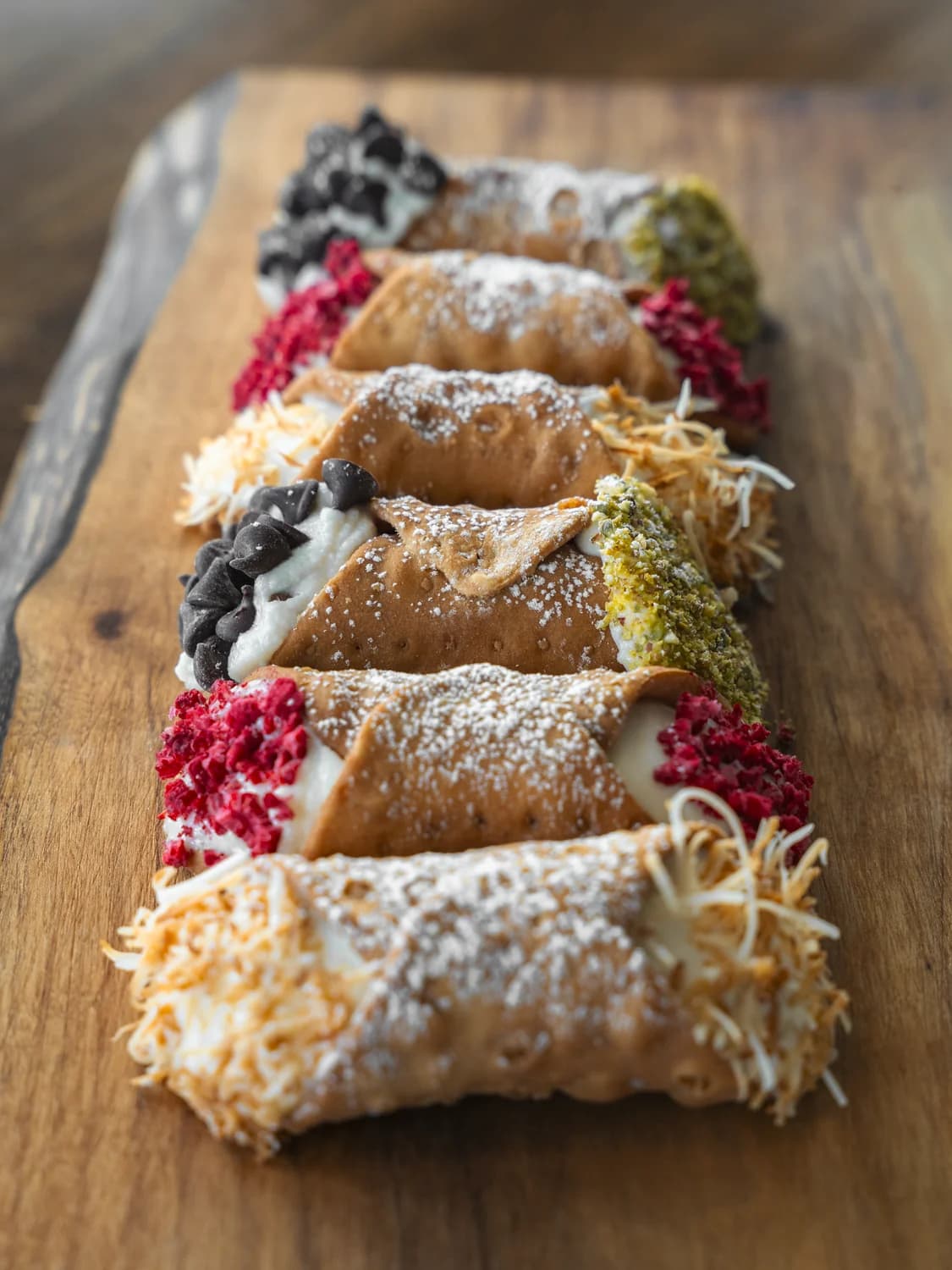 Selection of Cannoli Bros cannolis with signature toppings — served at weddings and events across Kelowna and the Okanagan